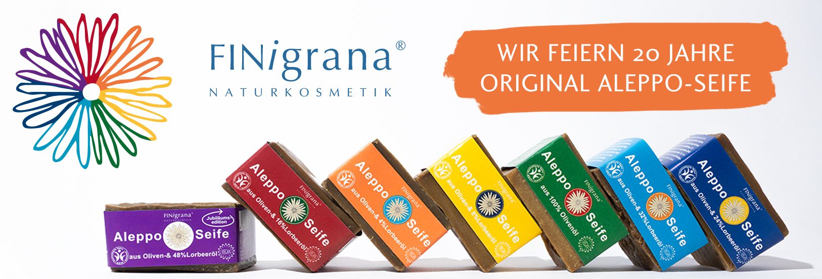 Finigrana Naturkosmetik Produktübersicht. Alepposeife gestapelt, Bio Buttter, Hautöle, Kokosöl im Glas und eine große Dose Reine Bio Sheabutter.